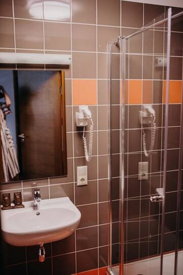 Фото номера Стандартный семейный номер Отель Comfort Hotel Kuldiga г. Кулдига 4