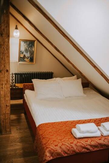 Фото номера Бутик-номер в мансарде Отель Boutique Hotel Virkas muiža г. Кулдига 15