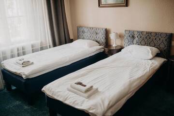 Фото номера Стандартный четырехместный номер Отель Boutique Hotel Virkas muiža г. Кулдига 11