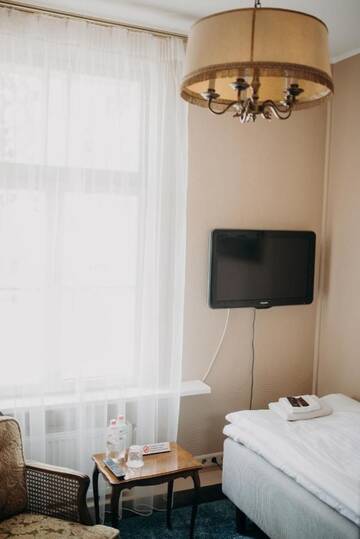 Фото номера Стандартный четырехместный номер Отель Boutique Hotel Virkas muiža г. Кулдига 6