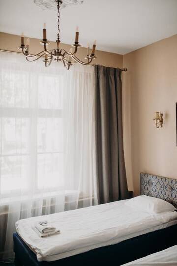 Фото номера Стандартный четырехместный номер Отель Boutique Hotel Virkas muiža г. Кулдига 10